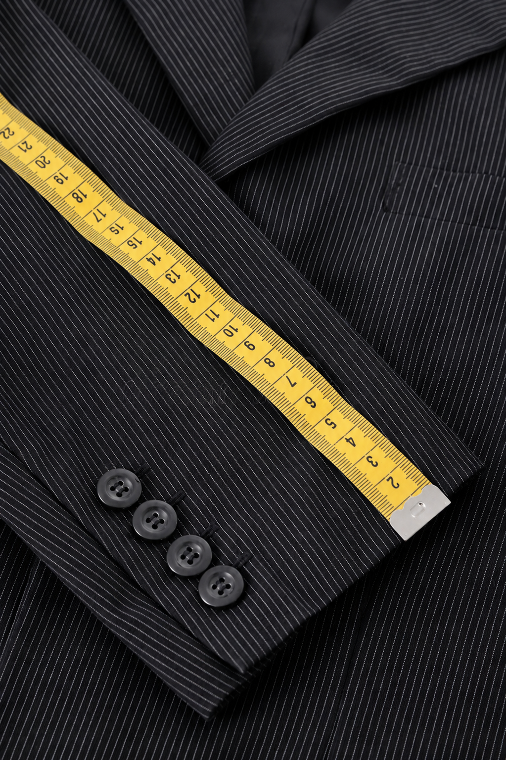 Pinstripe suit jacket with measuring tape